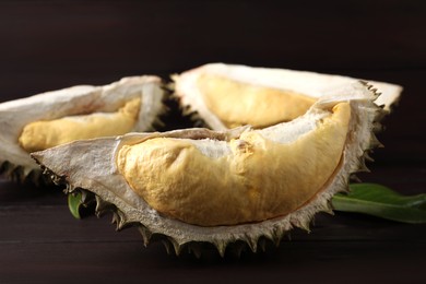 Fresh ripe durian on wooden table, closeup