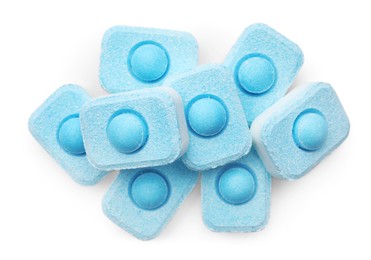 Photo of Pile of water softener tablets on white background, top view