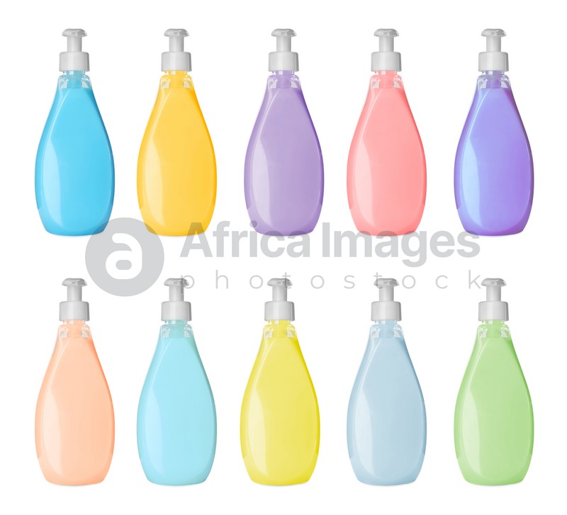 Set with bottles of multicolored liquid soap on white background