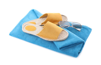 Blue towel, shoes and sunglasses on white background. Beach objects