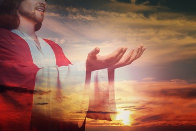 Jesus Christ reaching out his hands and praying at sunset, double exposure