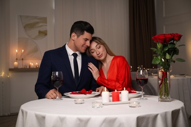 Lovely couple having romantic dinner in restaurant