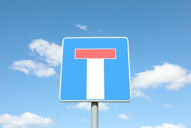 Traffic sign No Through Road For Vehicles against blue sky