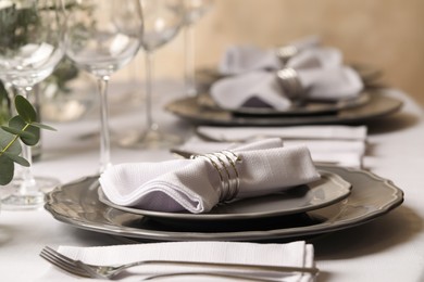 Stylish elegant table setting for festive dinner in restaurant