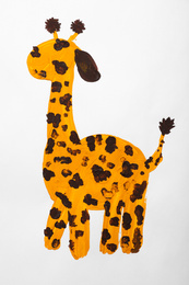 Child's painting of giraffe on white paper