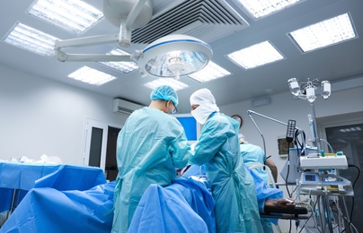 Medical team performing surgery in operating room
