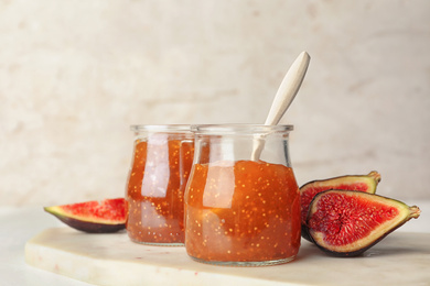 Homemade delicious fig jam on white table