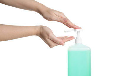 Photo of Woman applying antiseptic gel on hand against white background, closeup
