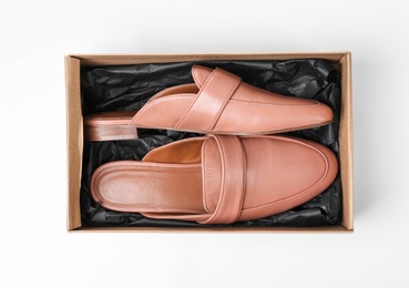 Photo of Pair of female shoes in box on white background, top view