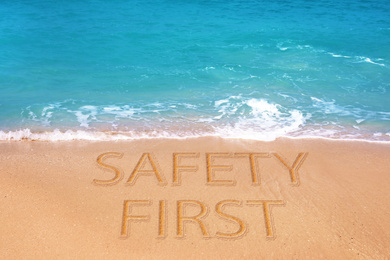 Safety first. Picturesque view of beautiful sandy beach on sunny day