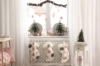 Beautiful room interior with small fir trees. Christmas decor