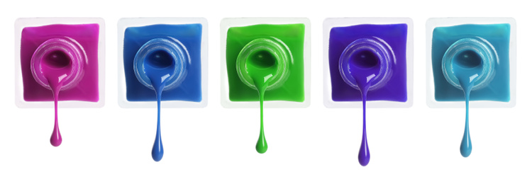 Set of different nail polishes dripping on white background. Banner design