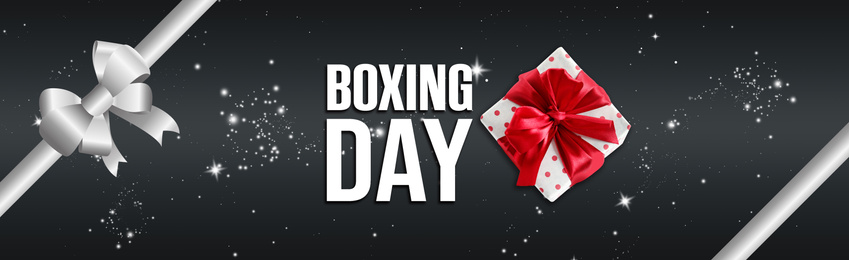 Text Boxing Day and gift on dark background with ribbon. Banner design