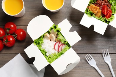 Flat lay composition with healthy takeaway food on wooden table