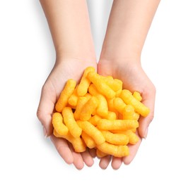 Woman holding pile of crunchy cheesy corn sticks on white background, top view