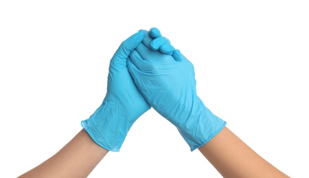 Doctor in medical gloves shaking hands on white background, closeup