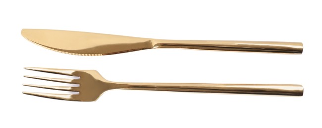 New shiny golden fork and knife on white background, top view
