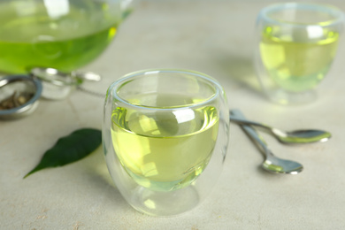 Fresh aromatic green tea on light table