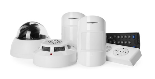 CCTV camera, remote controls, smoke and movement detectors on white background. Home security system