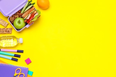 Flat lay composition with lunch box of healthy food and school stationery on yellow background, space for text