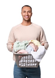 Photo of Happy man with basket full of laundry on white background