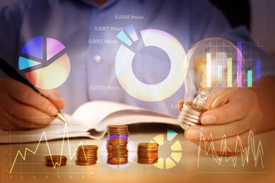 Forex trading. Charts and woman with light bulb at table, closeup