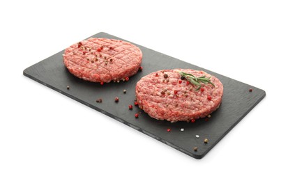Raw hamburger patties with rosemary and spices on white background