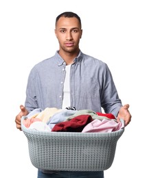Photo of Young man with basket full of laundry on white background