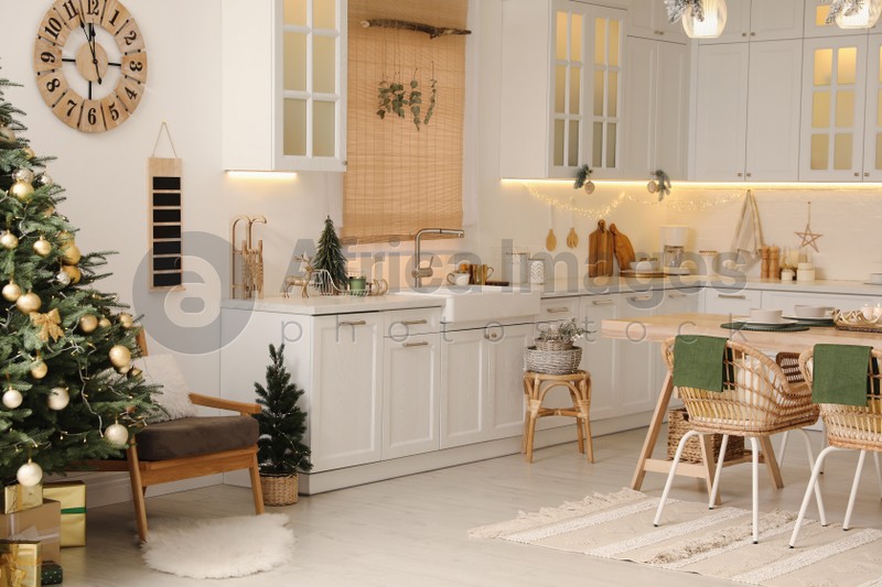 Cozy open plan kitchen decorated for Christmas. Interior design