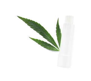 Hemp lipstick and green leaf on white background, top view. Natural cosmetics
