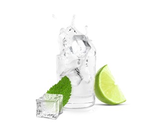 Shot of vodka with ice and lime on white background
