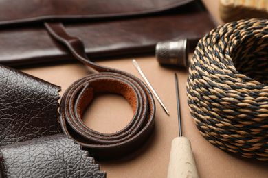 Leather samples and tools on table, closeup