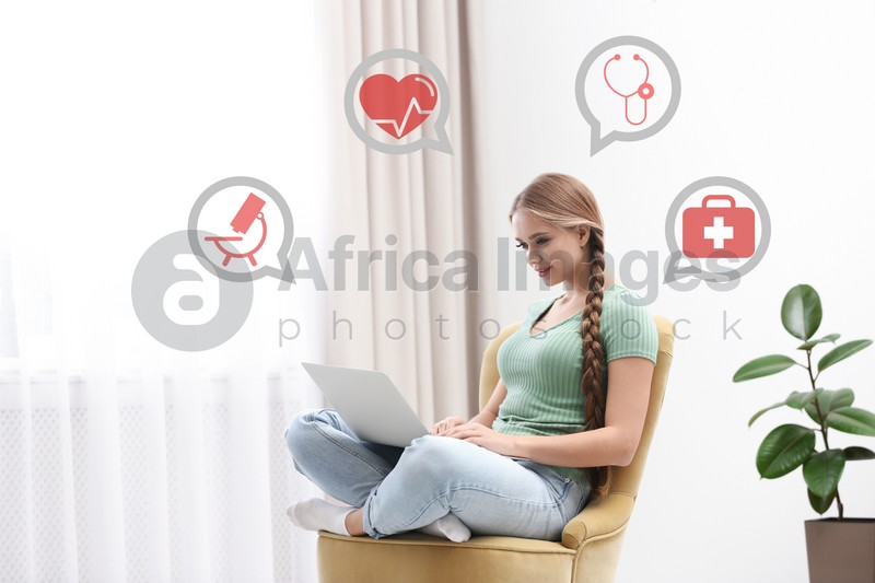 Image of Young woman with laptop in armchair at home. Medical Consultation Online