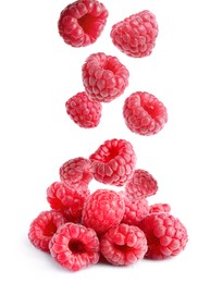Delicious ripe raspberries falling on white background