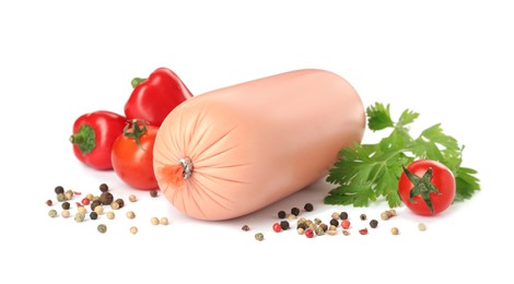Tasty boiled sausage with vegetables, parsley and peppercorns on white background