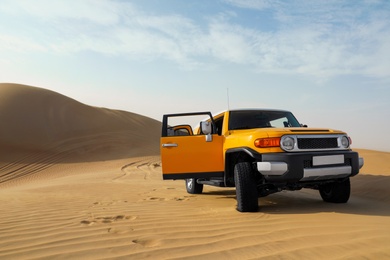 Modern car in desert ready for dune bashing