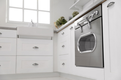 New modern oven in stylish kitchen. Cooking appliance