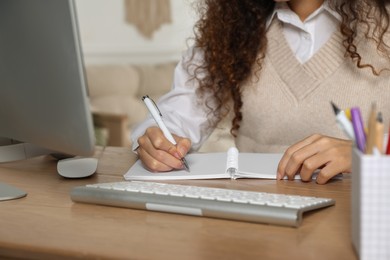 African American woman studying at home, closeup. Distance learning