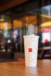 MYKOLAIV, UKRAINE - AUGUST 11, 2021: Cold McDonald's drink on table in cafe