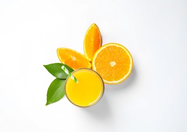 Glass of orange juice and fresh fruits on white background, top view