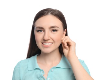 Photo of Young woman suffering from ear pain on white background