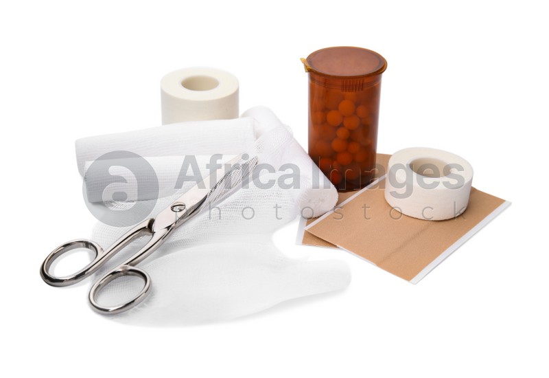 Photo of Bandage rolls and medical supplies on white background