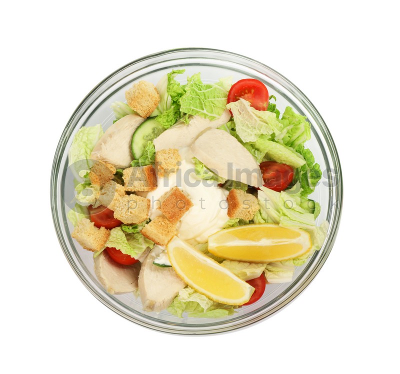 Bowl of delicious salad with Chinese cabbage, meat and bread croutons isolated on white, top view