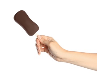 Woman holding ice cream glazed in chocolate on white background, closeup