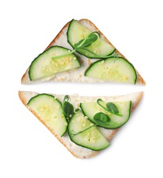 Photo of Tasty cucumber sandwiches with sesame seeds and pea microgreens on white background, top view