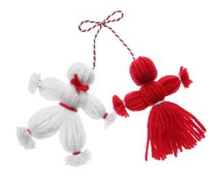Photo of Traditional martisor shaped as man and woman on white background. Beginning of spring celebration