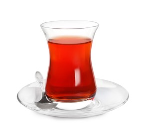 Glass of traditional Turkish tea with spoon isolated on white