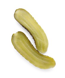 Halves of tasty pickled cucumber on white background, top view