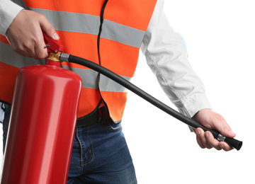 Worker using fire extinguisher on white background, closeup