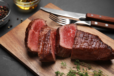 Delicious sliced beef tenderloin served on table, closeup